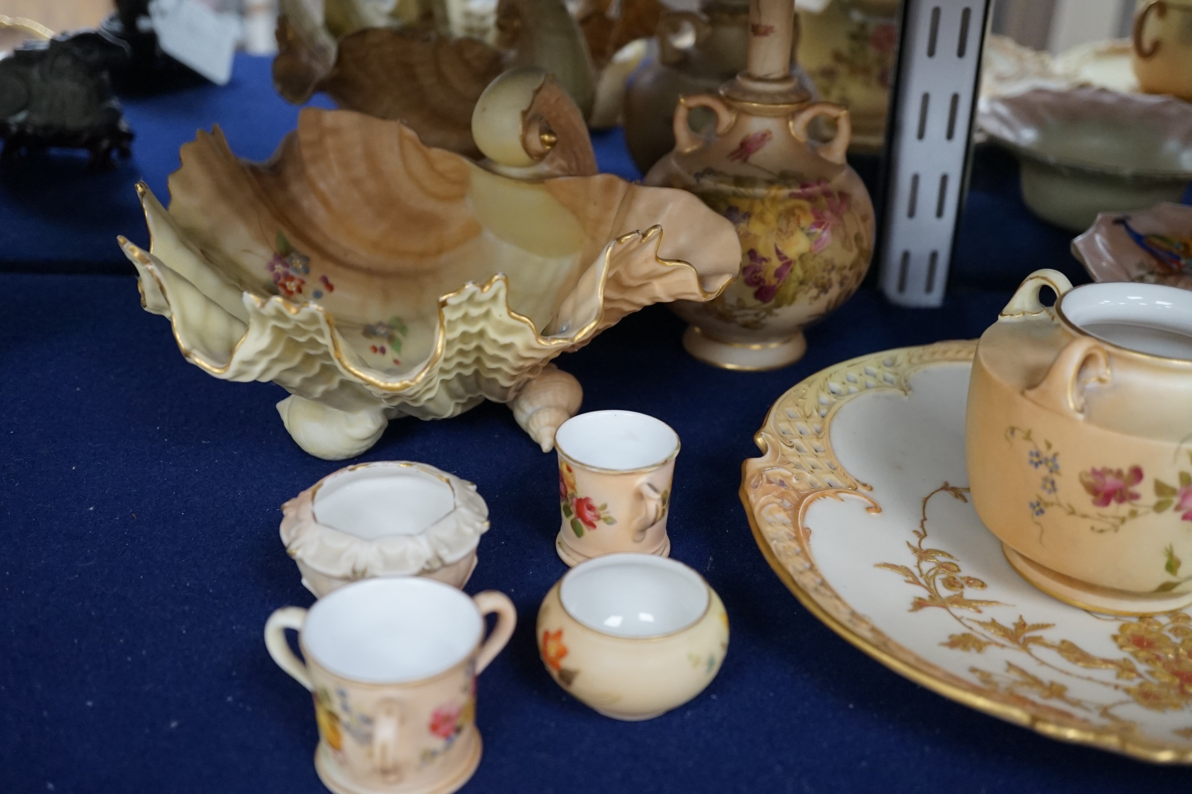 A group of ornamental Royal Worcester blush ivory ground items, including a shell dish, 18cm wide, two vases, a dish etc.
